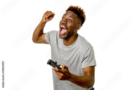  afro american man using remote controller playing video game happy and excited photo