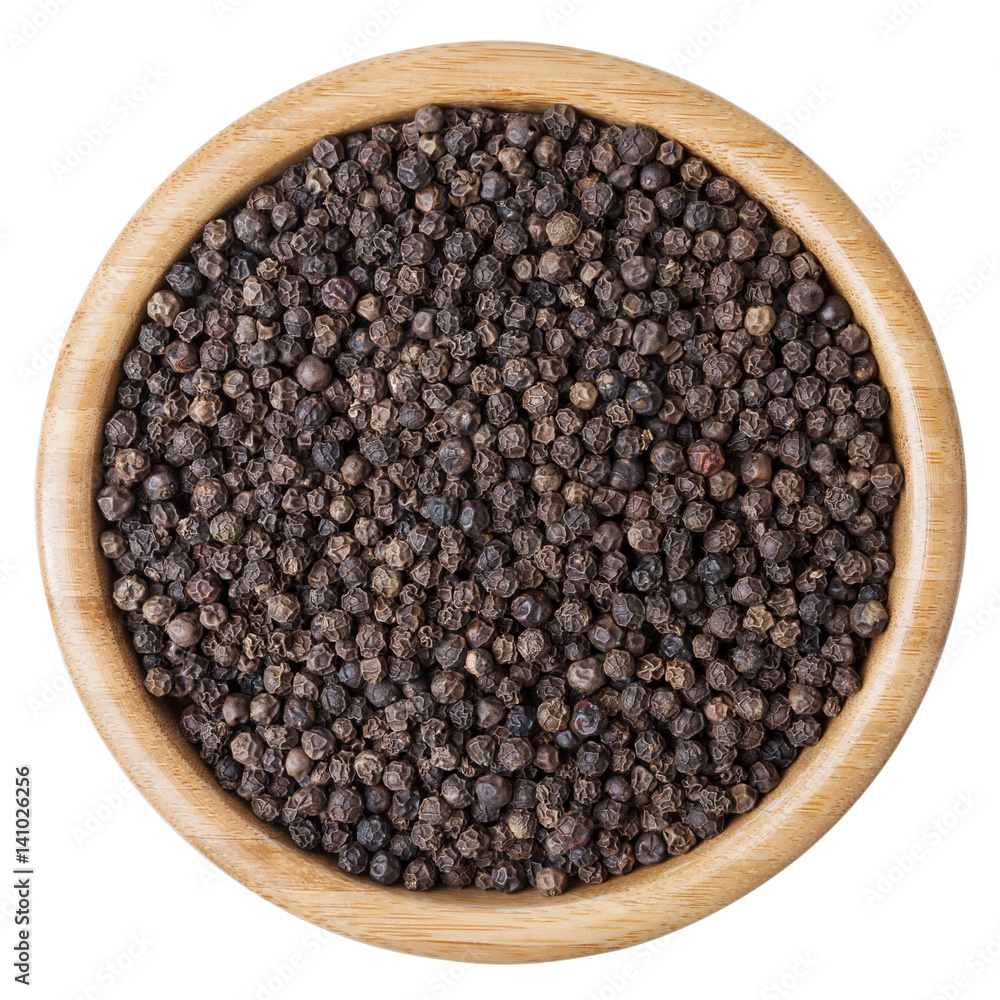 Black pepper corns in wooden bowl isolated on white background with clipping path Black pepper corns in wooden bowl isolated on white background with clipping path