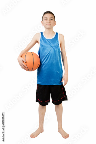 Young caucasian teenage boy with a basketball