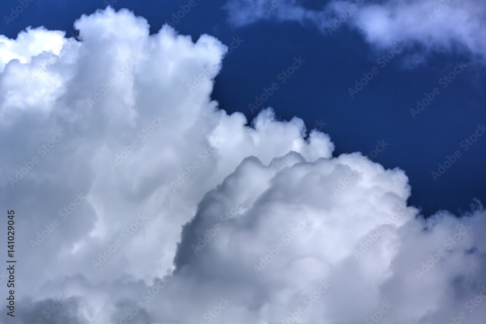 White clouds against blue sky. Day.