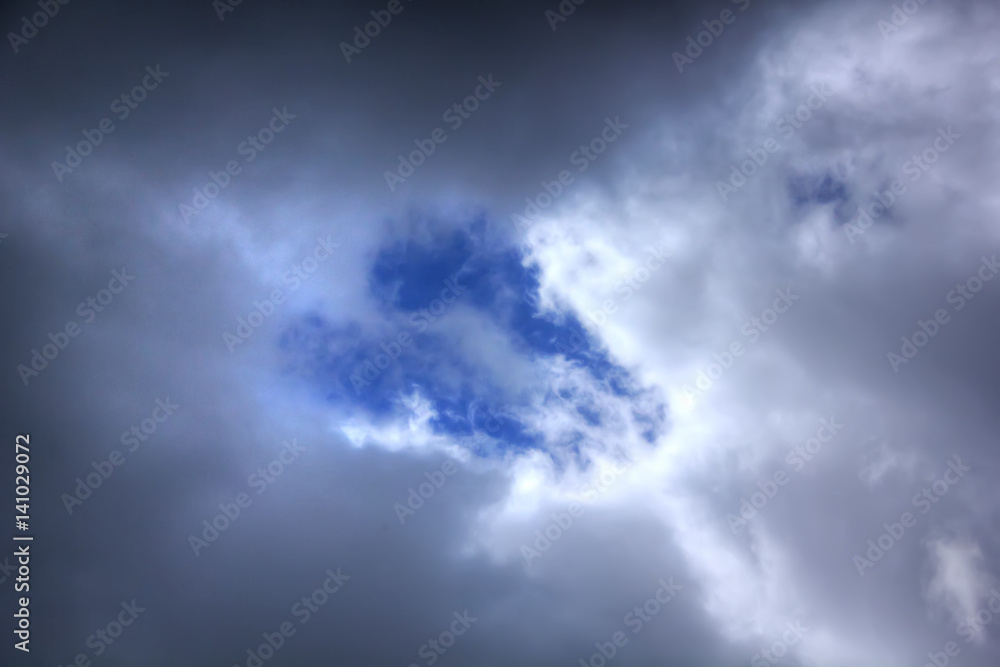 White clouds against blue sky. Day.
