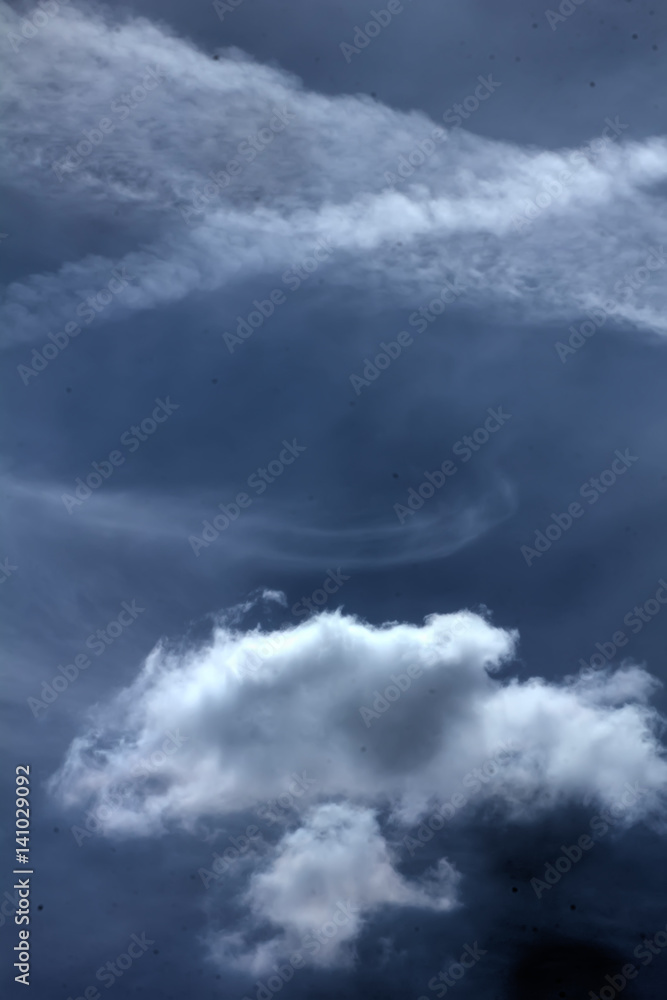 White clouds against blue sky. Day.
