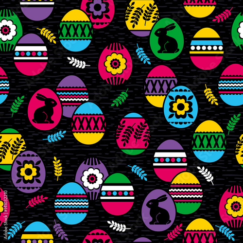 Seamless black background with color easter eggs, flowers and rabbit.Ideal for printing onto fabric and paper or scrap booking, vector illustration © sunnyfrog