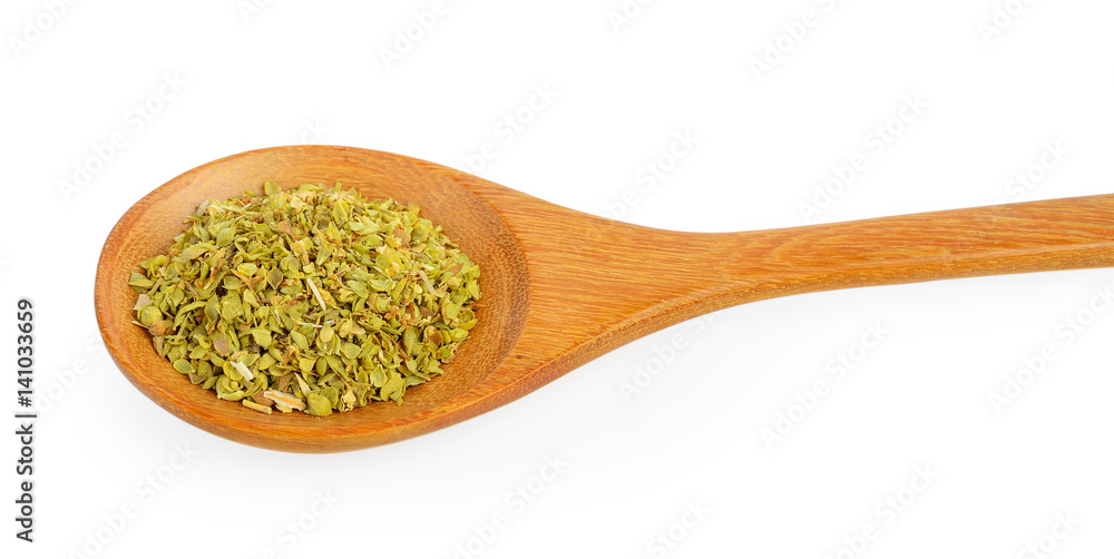 Dried oregano in wood spoon on white background Dried oregano in wood spoon on white background