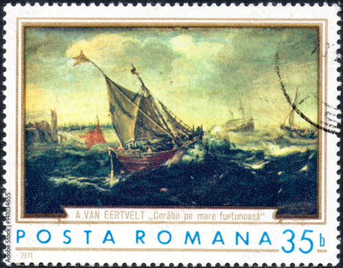 UKRAINE - CIRCA 2017: A stamp printed in the Romania shows ships in the storm by Andries van Eertvelt 1590-1652, circa 1971 photo