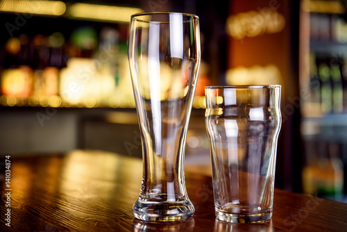 Glass of beer on a pub with bokeh background