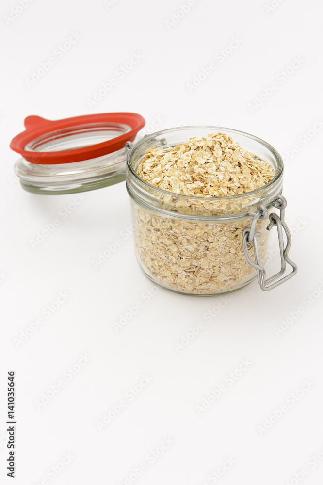 closeup of oat flakes in a canning jar, isolated on white closeup of oat flakes in a canning jar, isolated on white