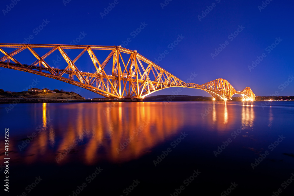 Obraz premium The Forth Rail Bridge is a cantilever railway bridge opened in 1890 that crosses the Firth of Forth between Edinburgh and Fife in Scotland. It is the second largest bridge of its kind in the world.
