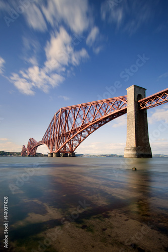 The Forth Rail Bridge is a cantilever railway bridge opened in 1890 that crosses the Firth of Forth between Edinburgh and Fife in Scotland. It is the second largest bridge of its kind in the world.