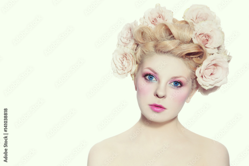 Young beautiful blue-eyed girl with fancy hairdo and make-up over white background