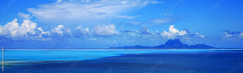 Panoramic view of Bora Bora island in Tahiti from off the coast of Taha'a.