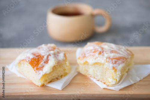 Fresh bread with icing, butter and sugar