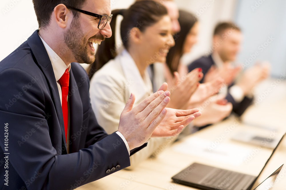 Fototapeta premium Happy smiling business team clapping hands during a meeting