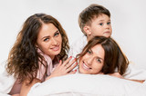 Mom with children in bed