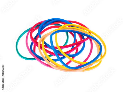 Multicolor rubber bands over a white isolated background