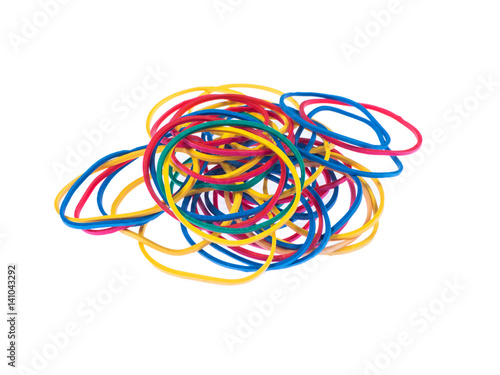 Multicolor rubber bands over a white isolated background