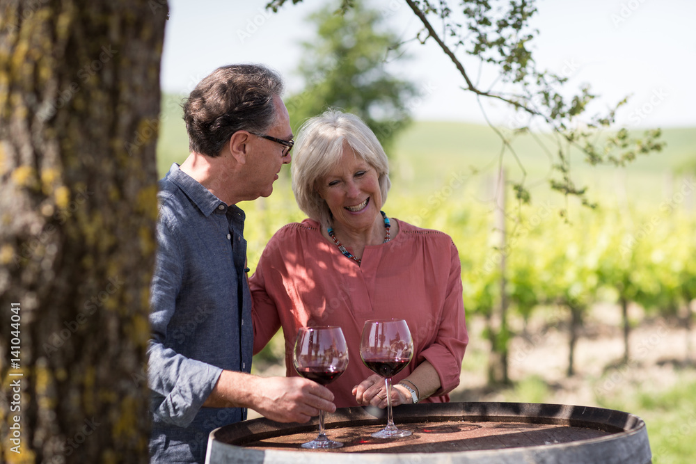 Senior couple visiting a vineyard Senior couple visiting a vineyard