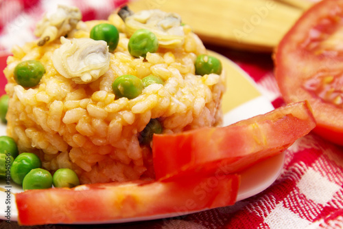 Risotto with seafood and tomato photo