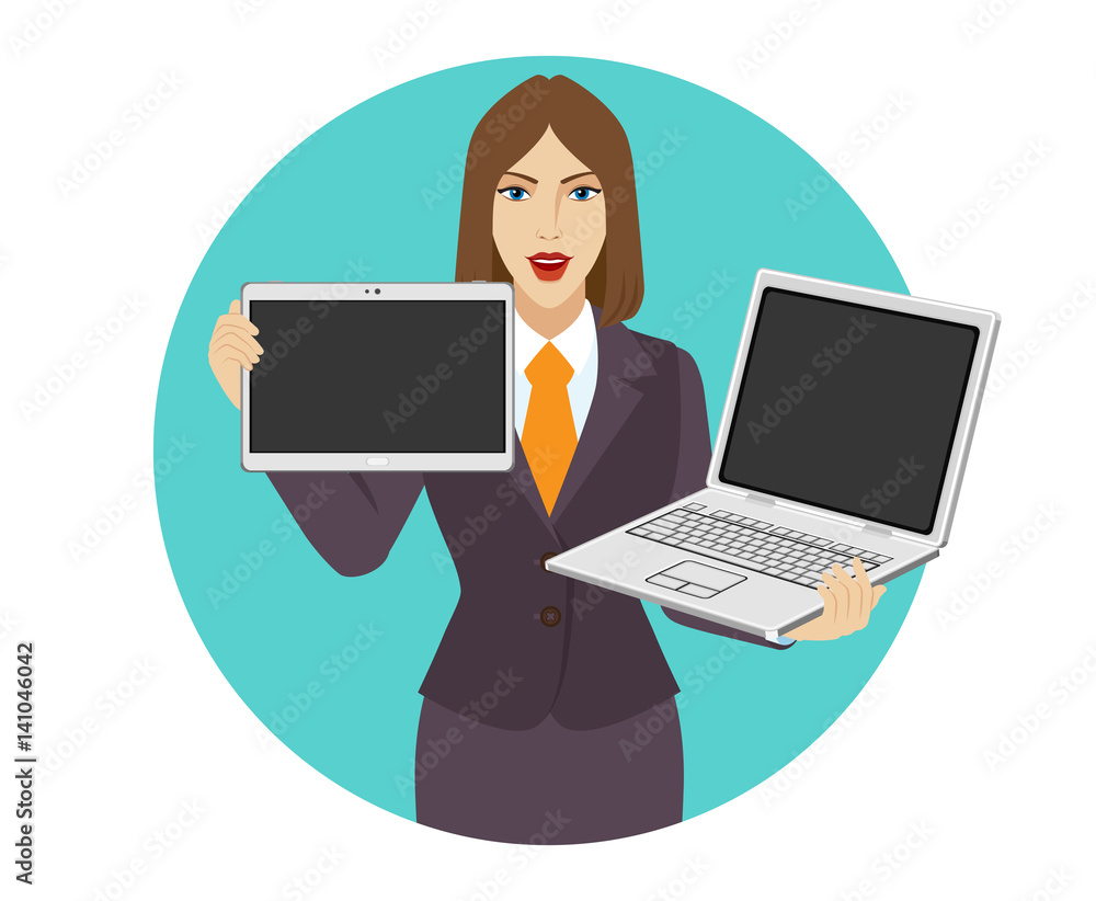 Businesswoman holding a laptop notebook and digital tablet PC Businesswoman holding a laptop notebook and digital tablet PC