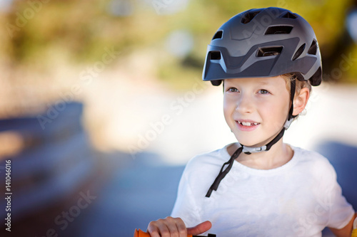 kid biking in helmet