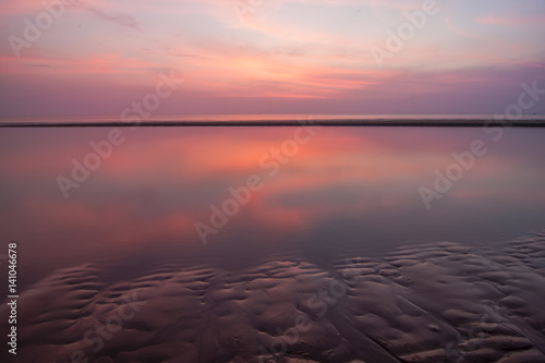 Beach and ocean view with colorful sky and reflect  in the morning, Prachuab Khiri Khan, Thailand photo