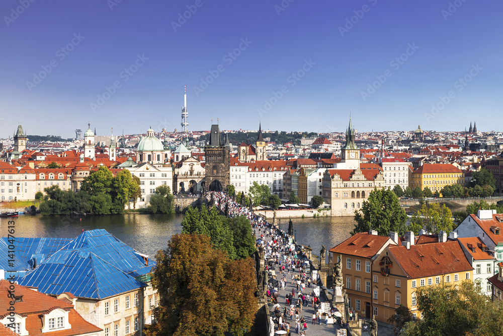 Top view of center of Prague with its red roofs and tower of the Charles bridge, Prague, Czech Republic