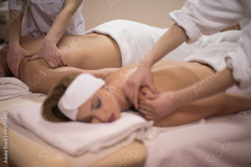 couple receiving a back massage