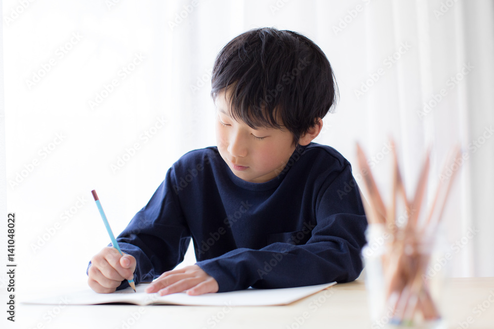 boy studying or doing home work boy studying or doing home work