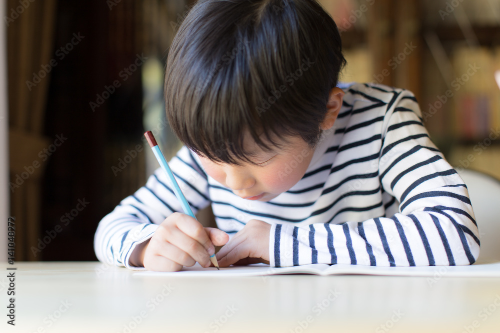 boy studying or doing home work boy studying or doing home work
