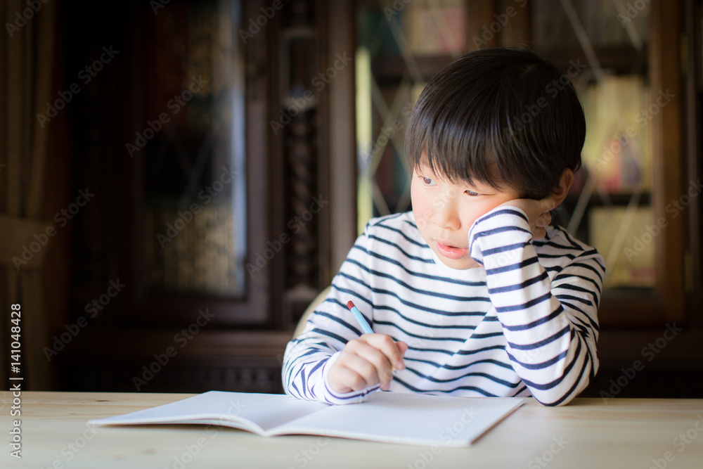 boy studying or doing home work boy studying or doing home work