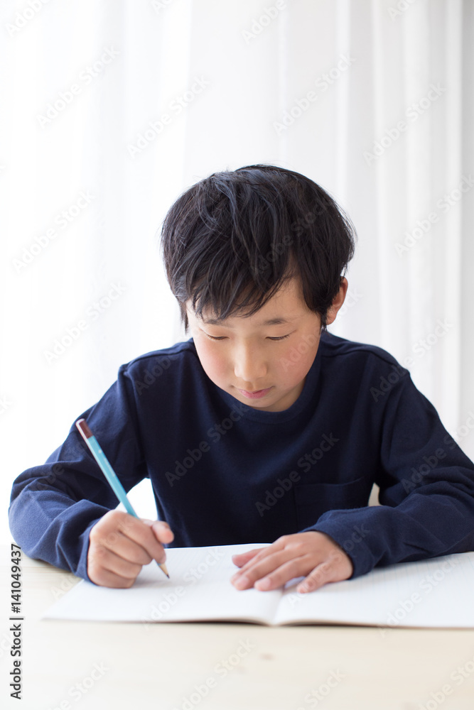 boy studying or doing home work boy studying or doing home work