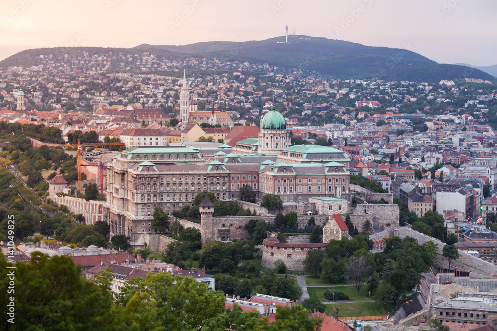 Evening panorama of Budapes from Gellert Hill with a beautiful sunset sky. Royal Palace at dusk