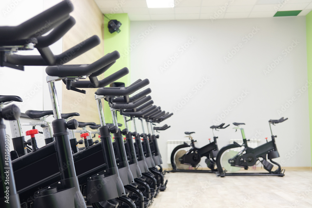Unterior of a fitness hall with sport bikes