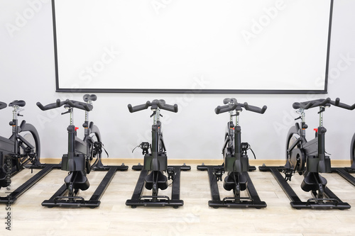 Unterior of a fitness hall with sport bikes