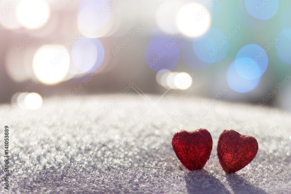 Two heart on a background of bright light Two heart on a background of bright light