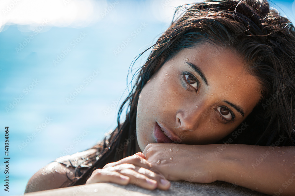 beautiful young latina woman in pink bikini portrait at swimming pool Stock  Photo | Adobe Stock