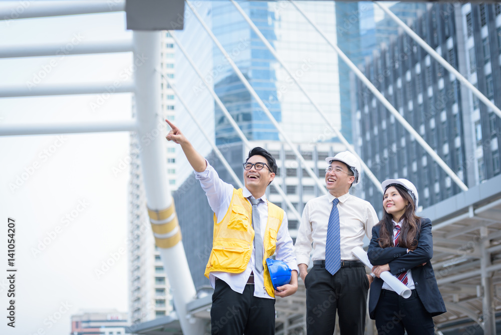 feeling happy woman engineer standing with architects and worker looking success feeling happy woman engineer standing with architects and worker looking success