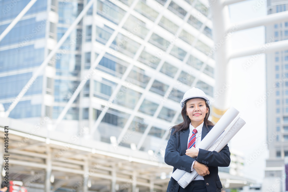 engineer construction industry standing in city and hand holding blueprint engineer construction industry standing in city and hand holding blueprint
