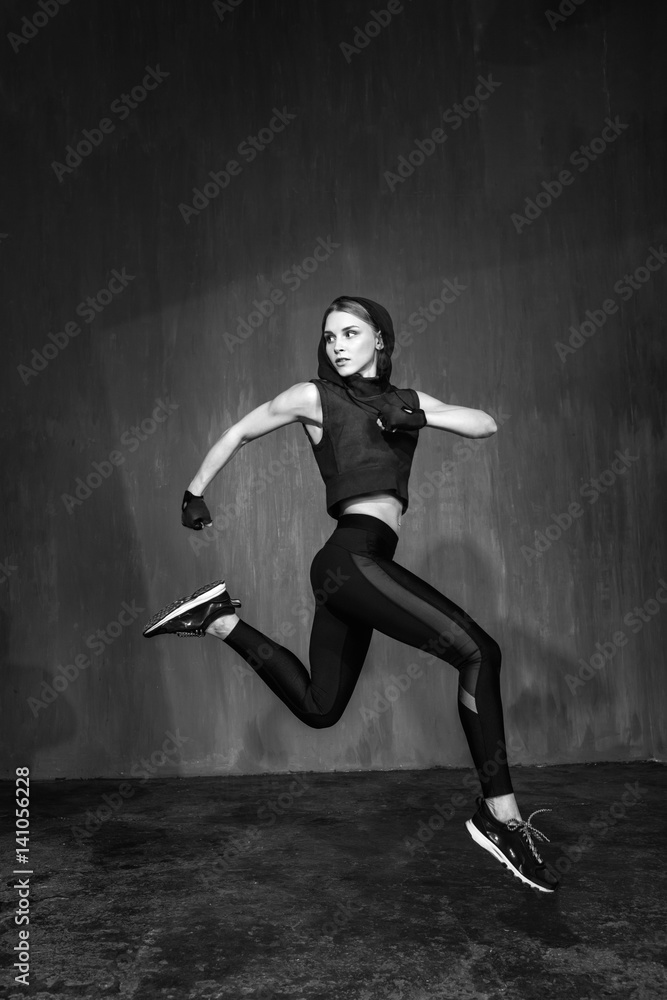 Young beautiful fitness female posing in studio Young beautiful fitness female posing in studio
