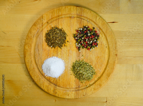 difernt spices, pepper, salt, oregano and cumin photo