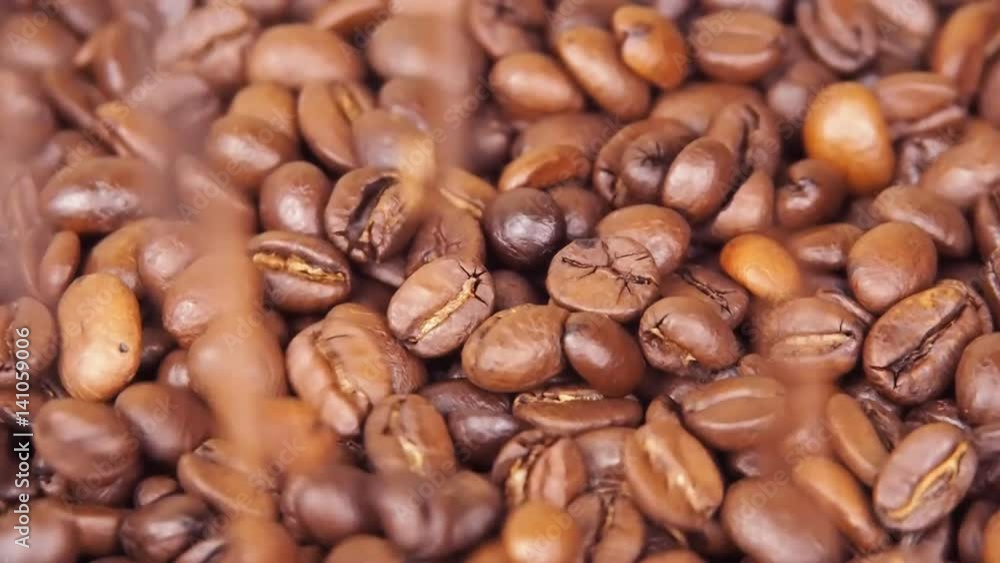Coffee beans. Close-up. Along coffee beans. Floating over fried coffee. Slow-motion Coffee beans. Close-up. Along coffee beans. Floating over fried coffee. Slow-motion