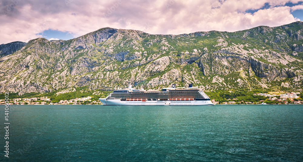 Cruise liner goes to Kotor by small old authentic towns. Boka Kotorska gulf, Montenegro. Cruise liner goes to Kotor by small old authentic towns. Boka Kotorska gulf, Montenegro.