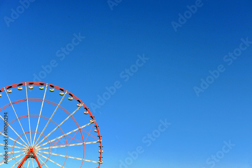 Ferris wheel with sky on background