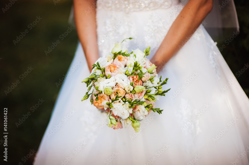 Wedding Flowers Roses Bouquet in Bride Hands with White Dress on Background StockFoto Adobe Stock