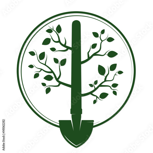 Shovel with branches and green leaves