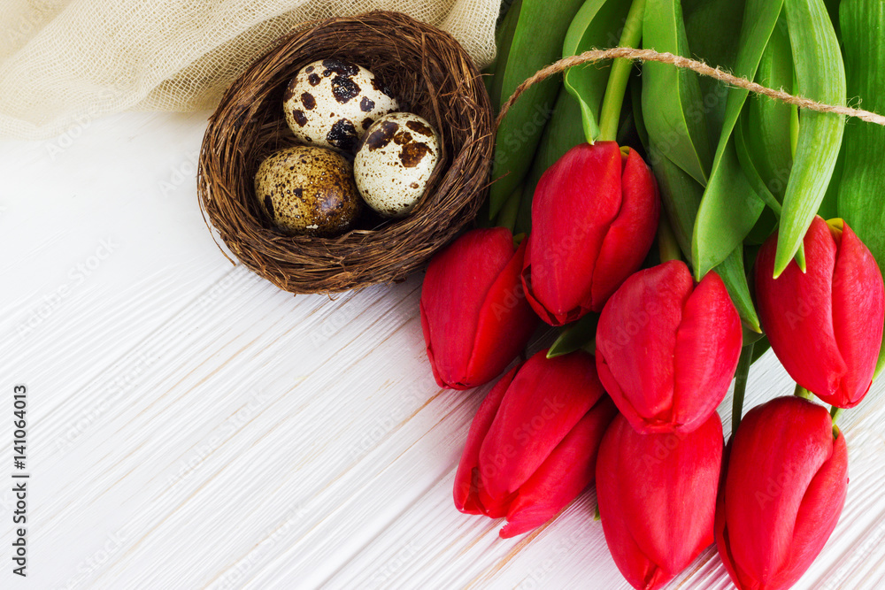 Bouquet red tulip flowers with easter eggs Bouquet red tulip flowers with easter eggs