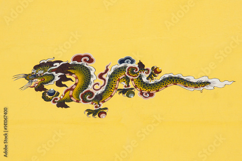 Traditional ancient style bhutanese wall painting, dragon, on the plastered house wall, painted by artist Gyalse Wangdi , in Thimphu, Bhutan, Asia