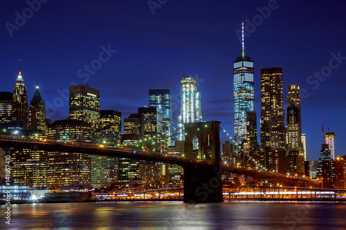 New York City s Brooklyn Bridge and Manhattan skyline illuminated