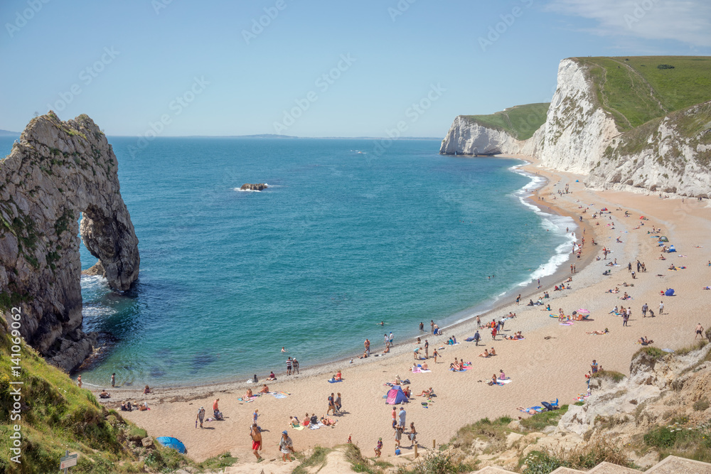 Durdle door beach in Dorset, UK on a sunny summer's day