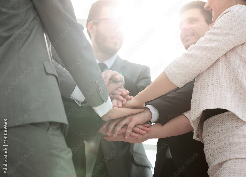 success concept: friendly business team standing in a circle and success concept: friendly business team standing in a circle and